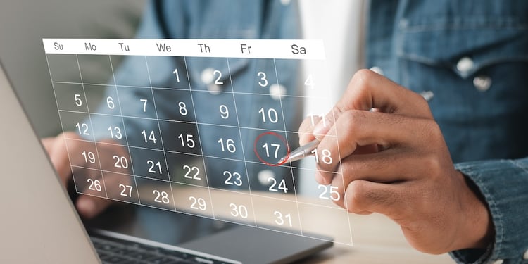 Man chooses a date on a virtual calendar from his computer