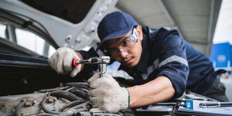 Technician working on a vehicle 